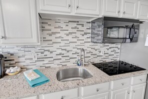 Fridge, microwave, stovetop, coffee/tea maker