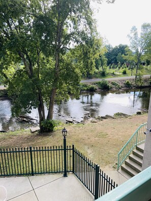 Stroll along the serene river and enjoy the lush surroundings.