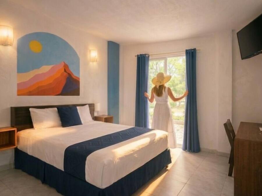 Habitación ejecutiva, vistas a la ciudad | Cortinas opacas, wifi gratis, ropa de cama