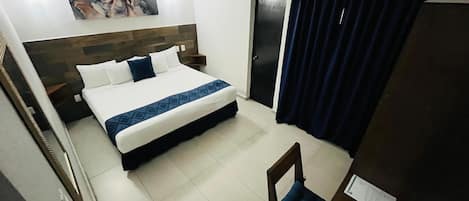 Executive-huone, 1 suuri parisänky | Pimennysverhot, ilmainen Wi-Fi, vuodevaatteet