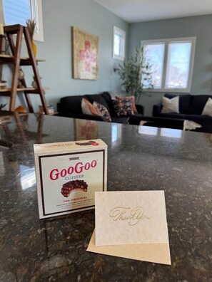 A GoGoo Cluster box and a thank you card on a kitchen counter. - Charming townhome, Pet Friendly, 5 Min to Downtown (Nashville)