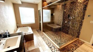 Bathtub, hair dryer, towels, soap
