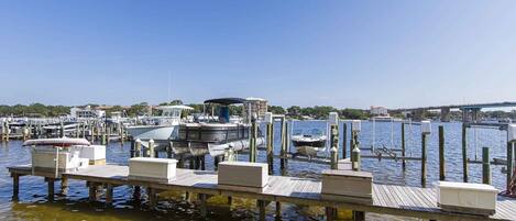 A marina with docked boats and a clear blue sky.