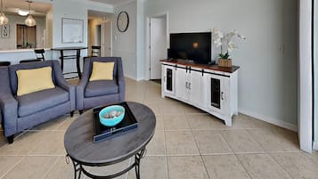 Condo, Multiple Beds, Balcony | Living area | TV