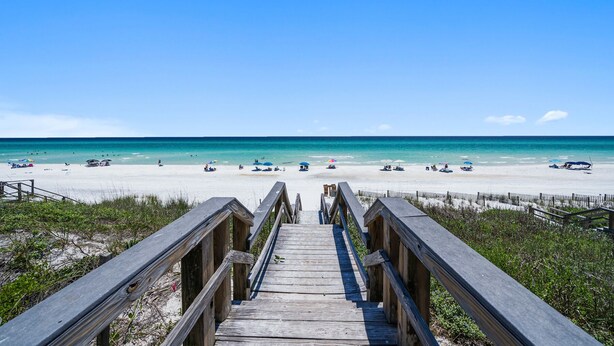A wooden boardwalk leading to a beach with clear turquoise water and a sandy shore. - Gulf Place Six Palms #2B - BB's Hideaway by Southern Vacation Rentals (Santa Rosa Beach)