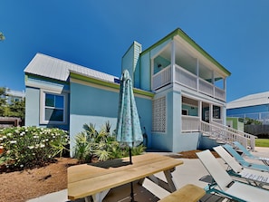 Enjoy ocean views from the upper-floor balcony, perfect for outdoor dining or relaxation.