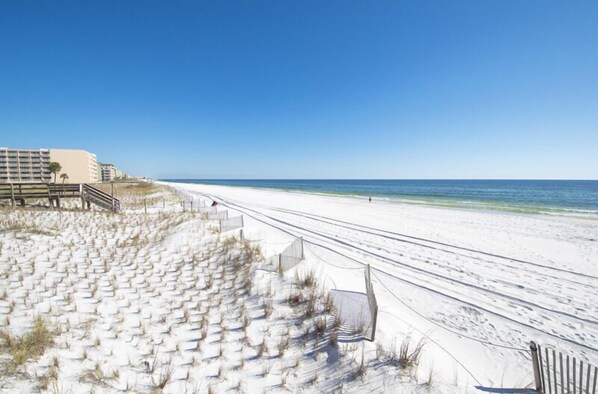 Guests can enjoy access to the beach via steps leading down to the water.