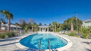 A swimming pool with a gazebo, palm trees, and lounge chairs. - Salt & Sand - Serenity on 30A - Hidden Lakes Condo 321 (Santa Rosa Beach)