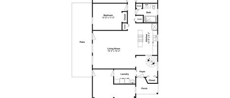 A floor plan of a house with a patio, two bedrooms, a living room, a kitchen, a laundry area, a foyer, a porch, and a garage.