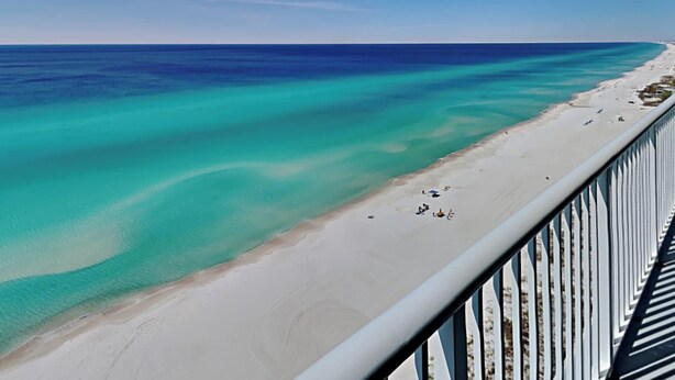 A beach with clear turquoise water and a sandy shore. - Palazzo #1407 by Resort Collection (Panama City Beach)