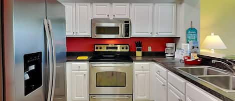Condo, Multiple Beds, Balcony | Private kitchen | Fridge, microwave, oven, stovetop