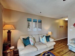 Condo, Multiple Beds, Balcony, Partial Sea View | Living area | TV - Grand Caribbean #210 East (Destin)