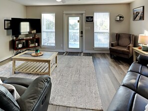 House, Multiple Beds, Balcony, Garden View | Living area | 40-inch TV with digital channels