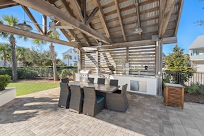 Enjoy al fresco dining on the patio, where a grill station and dining set await.