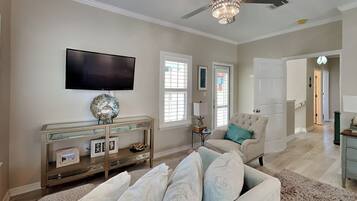 House, Multiple Beds, Balcony, Garden View | Living area | 40-inch TV with digital channels