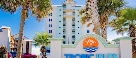A hotel entrance with a sign reading 'TROPIC ISLES 433'.