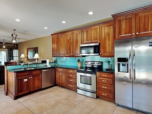 Enjoy cooking in this well-equipped kitchen with an oven, microwave, and dishwasher.