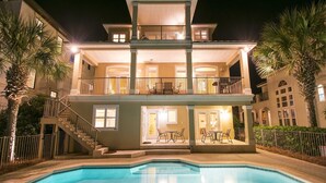 A two-story building with a swimming pool in front. - Margarita by Southern Vacation Rentals (Destin)