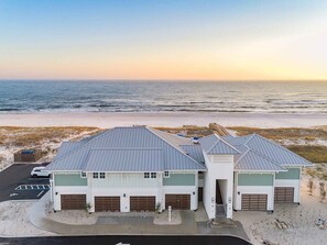 Situated on a sandy beach, this coastal building offers a unique blend of functionality and ocean views.