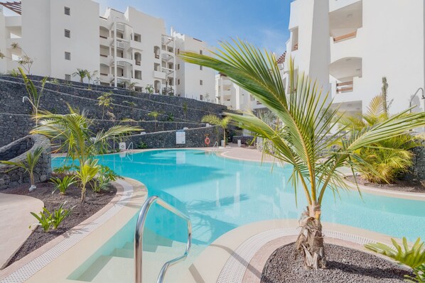 A heated pool, pool loungers