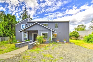 Welcome to this charming home, featuring a covered front porch and a serene garden setting.