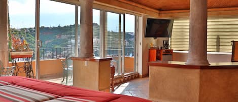 Deluxe Studio Suite (Cadbury) | Bathroom | Shower, hair dryer, slippers, towels