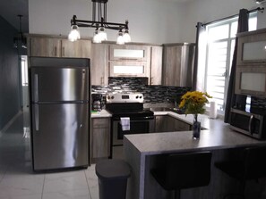 Luxury Condo | Private kitchen | Full-sized fridge, microwave, oven, stovetop - Jobos Luxury Condos (Isabela)