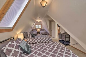A bedroom with two beds, a dresser, and a skylight. - Hot Tub & Mtn View: Dog-Friendly Payson Getaway! (Payson)