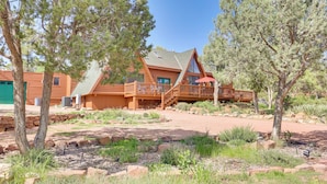 A log cabin with a deck and a covered patio. - Hot Tub & Mtn View: Dog-Friendly Payson Getaway! (Payson)