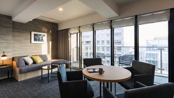 Deluxe King Room, Non Smoking | Living area | Flat-screen TV