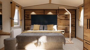 Un dormitorio moderno con una cama grande, paneles de madera en las paredes y un aplique colgante.