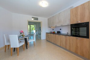 Family Apartment, Multiple Bedrooms (Rivoltella Apt With Pool 600m From) | Private kitchen | Fridge, microwave, oven, stovetop