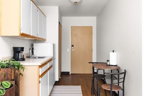 Fridge, microwave, coffee/tea maker, cookware/dishes/utensils