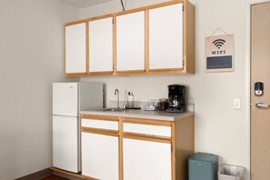 Fridge, microwave, coffee/tea maker, cookware/dishes/utensils