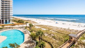 A beachfront hotel with a swimming pool, beach access, and ocean views. - Beach Colony Towers by Southern Vacation Rentals (Pensacola)