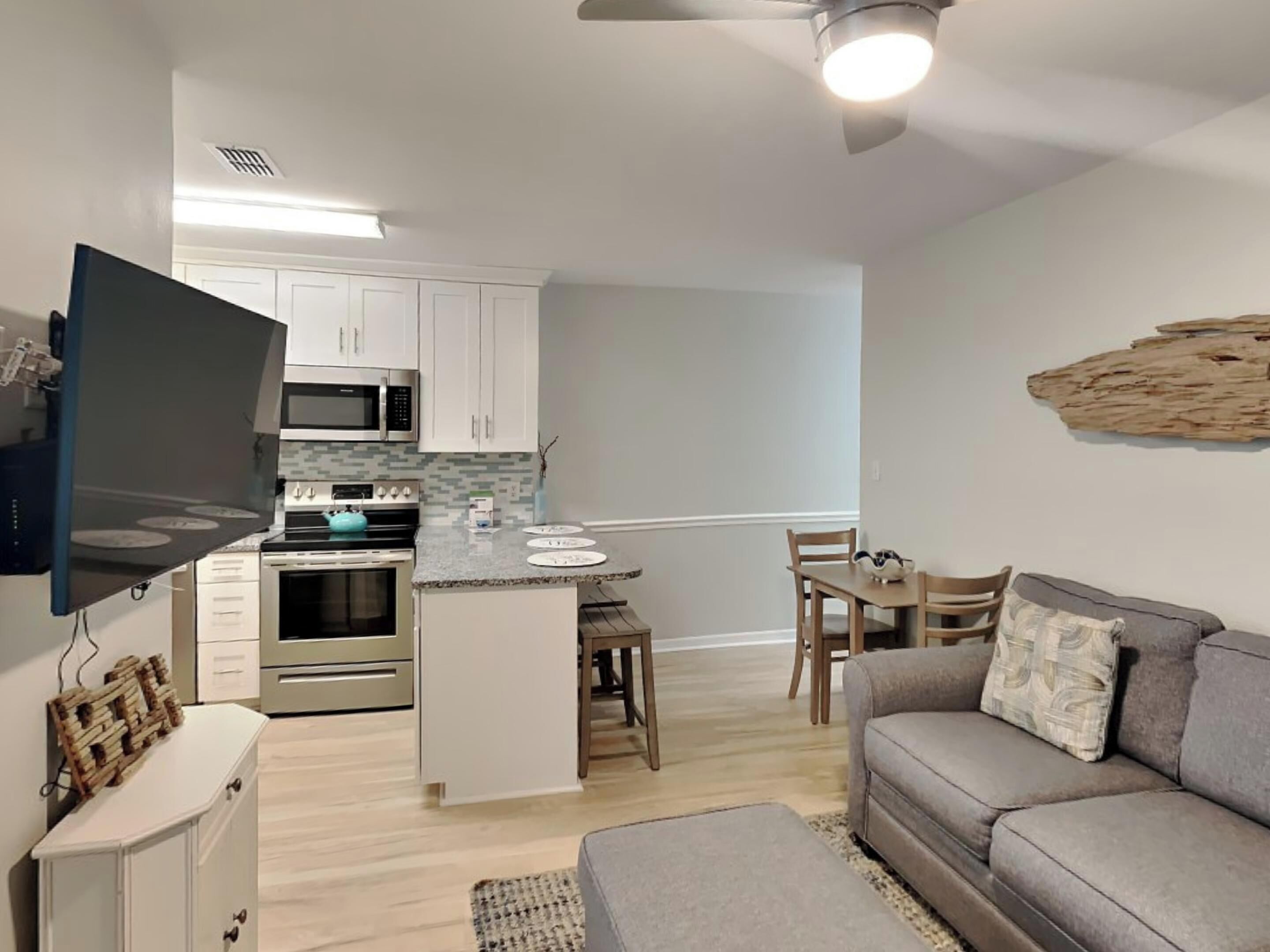 Condo (#213 - No Pets) | Living area | 42-inch flat-screen TV with digital channels