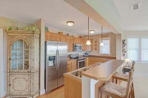 Dishwasher, coffee/tea maker, cookware/dishes/utensils, dining tables