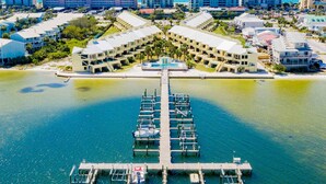A resort with multiple buildings, a marina, and a beach. - Buena Vida Townhomes by Southern Vacation Rentals (Navarre)