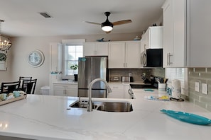 Condo, Multiple Beds, Balcony, Garden View (#138 - No Pets) | Private kitchen | Fridge, microwave, oven, stovetop - Bungalows at Seagrove by Southern Vacation Rentals (Santa Rosa Beach)