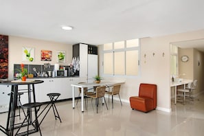Fridge, microwave, stovetop, coffee/tea maker
