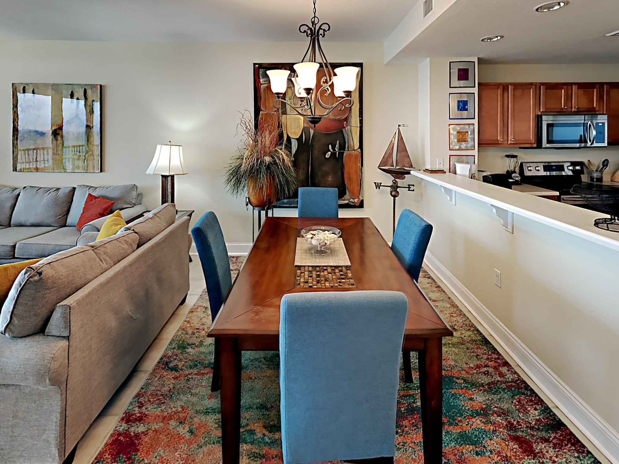 A modern kitchen with a microwave, stove, and cabinets.