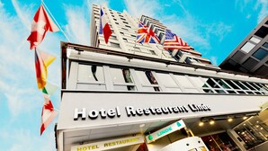 A hotel with a sign reading "Hotel Restaurant Lindé" and flags of various countries. - Hotel Linde 24h Self Check-in (Baden)