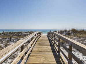 A wooden boardwalk leading to a beach with clear skies. - Mainsail by Southern Vacation Rentals (Miramar Beach)