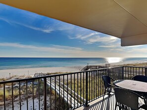 A balcony with a view of the beach and ocean. - Ocean Breeze West by Southern Vacation Rentals (Pensacola)
