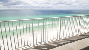 A balcony with a view of a beach and ocean. - Ocean Reef by Resort Collection (Panama City Beach)