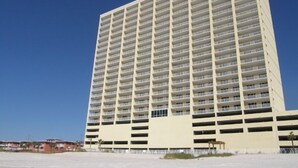 A high-rise hotel with multiple floors and balconies, featuring a modern architectural design. - Ocean Reef by Resort Collection (Panama City Beach)