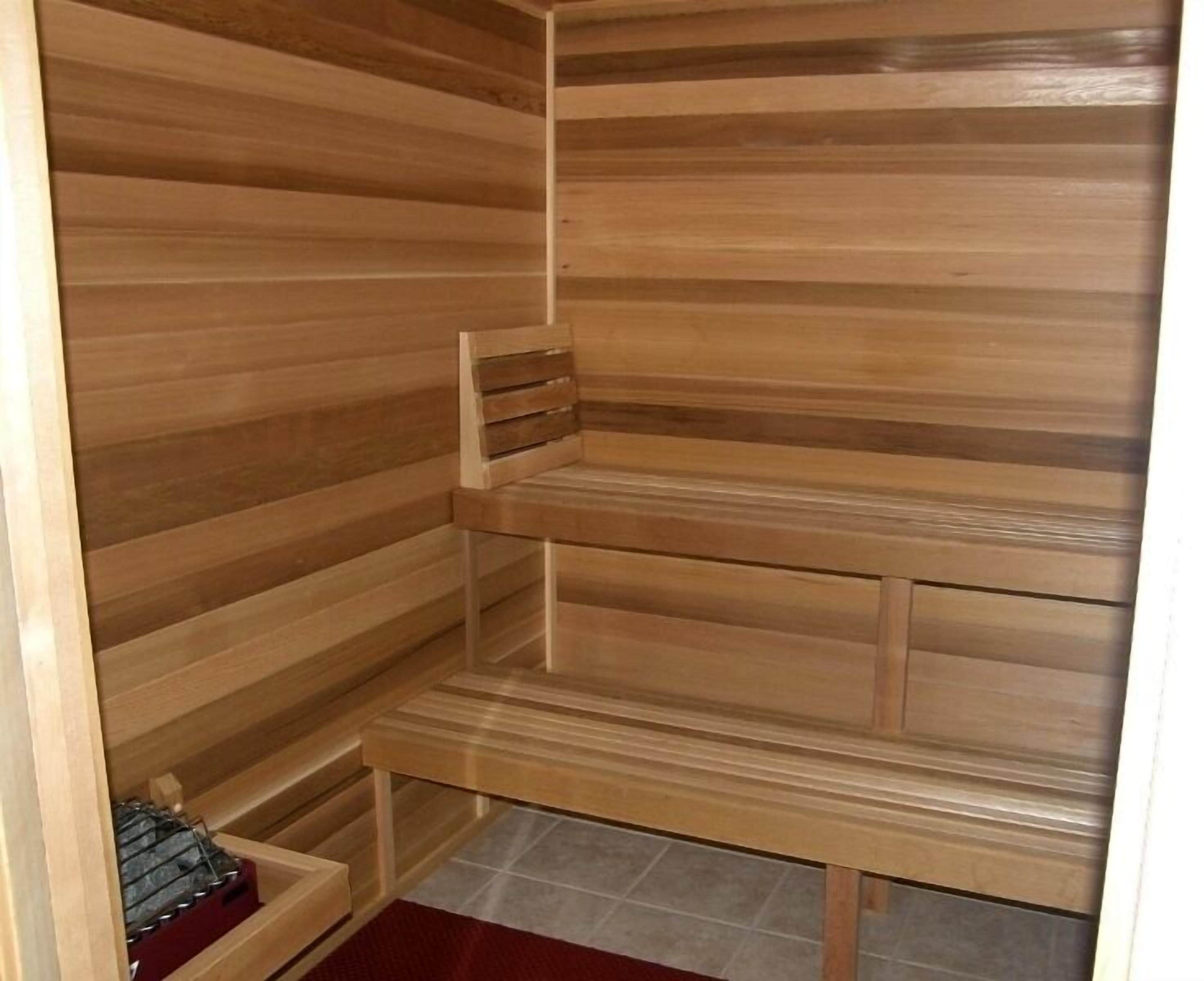 A sauna with wooden walls and benches.