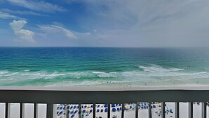 A beach view with a balcony overlooking the ocean. - Pelican Beach by Southern Vacation Rentals (Destin)