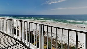 A balcony with a view of the beach and ocean. - Regency Isle by Southern Vacation Rentals (Orange Beach)