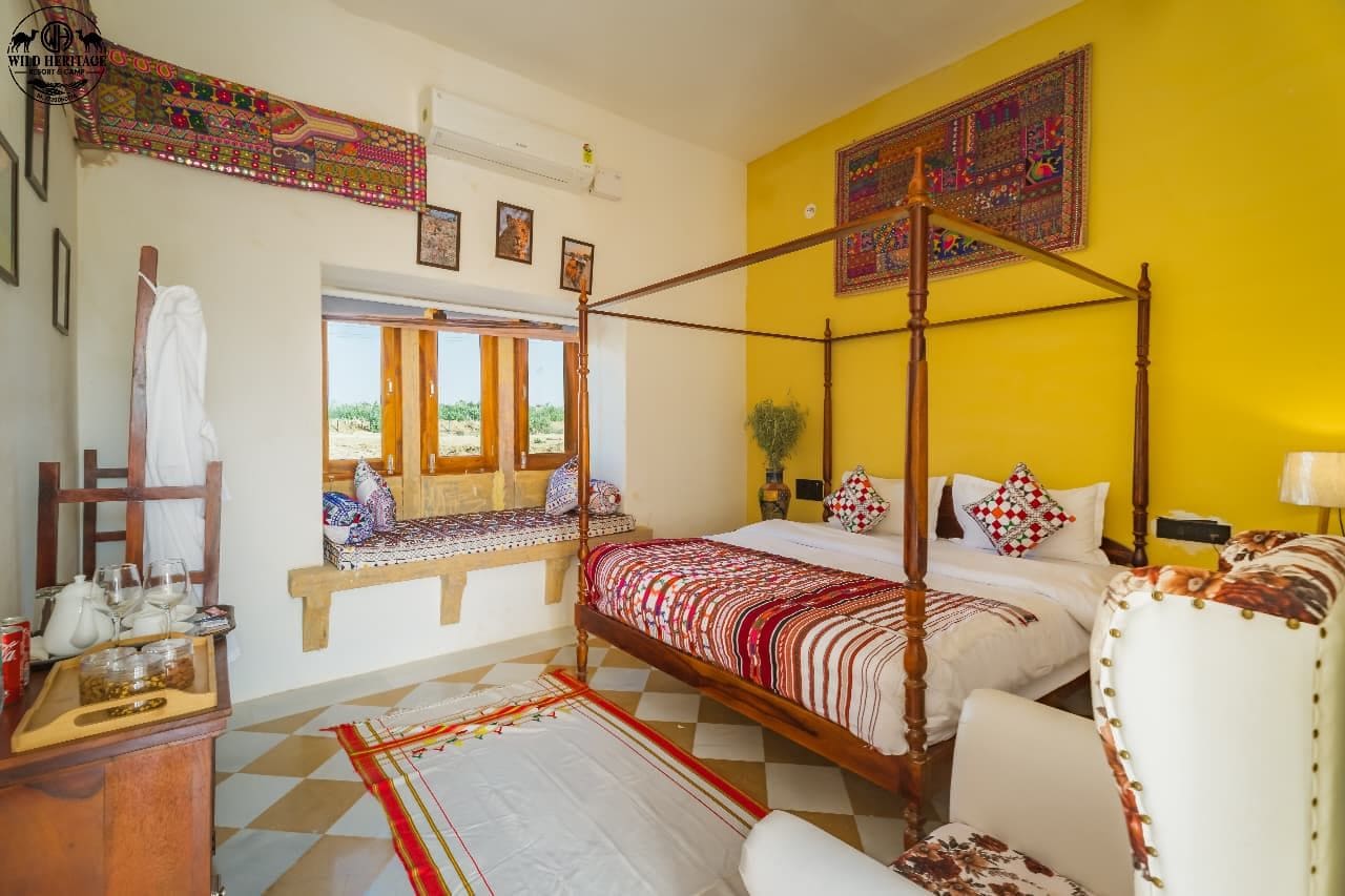 A four-poster bed with a checkered floor, a bench with cushions, and a window with a view.